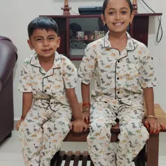 Sibling goals. This brother and sister duo look so happy in their matching Dino print pyjama sets, a fun and popular choice for kids of all ages.