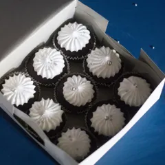Sometimes, simple is best. This box of classic chocolate cupcakes with white meringue-style frosting was made to accompany a larger themed cake. They are a perfect, elegant addition to any dessert order.