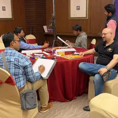 Here's my team and I set up and ready to draw at a large medical conference for over 250 professionals at the O Hotel in Pune. We can handle events of any size.
