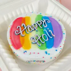 A colourful and happy bento cake I made for the festival of Holi. This mini chocolate cake is perfect for a small celebration, decorated with the vibrant colours of the festival.
