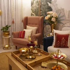A cozy corner of my living room during Diwali. The brass candle holders and festive cushions create a warm and inviting atmosphere.
