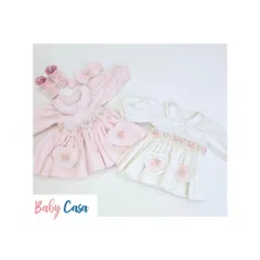 A pair of our sweet heart-themed dresses in pink and white. These outfits are perfect for sisters or for a baby's first photoshoot.