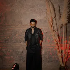 An all-black ensemble with a leather jacket, perfect for a cool, edgy vibe at an after-party in Georgia.