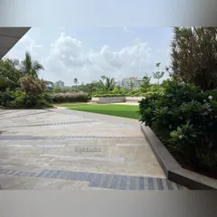 A patterned stone walkway cuts across the corporate plaza, leading towards the central lawn. I use contrasting stone patterns to define pathways and add geometric interest to large paved areas, guiding movement through the landscape.