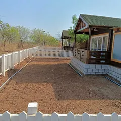 The starting point for a farmhouse landscape. Here you can see the bare, prepared red soil before we began the lawn installation and planting work.