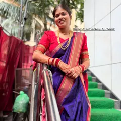 This photo shows the elegant fall of the Nauvari saree. This draping service was provided along with makeup and hairstyling for a complete guest makeover.