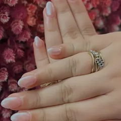 A beautiful example of a "baby boomer" or French ombré nail, where the white tip softly fades into the pink base. The pearly finish gives it an extra glow.