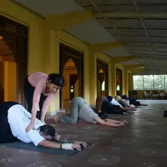 Guiding students through a gentle stretch during our Dehradun retreat. Creating a tranquil space for growth and connection is at the heart of my teaching.