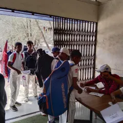 Young cricketers line up at the registration desk for our selection trials. We see determination in their eyes even before they step onto the field.