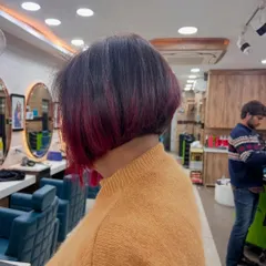 The same angled bob from a different view, showing how the pop of magenta peeks through with movement.