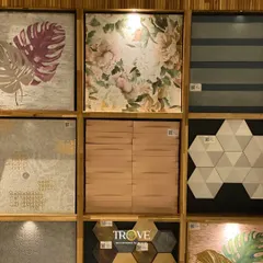 A selection of my patterned and textured tiles. You can see floral prints, geometric hexagons, wood-look textures, and leaf motifs, all designed to help you create a unique and elegant space.