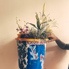 On another side of the same planter, I painted these serene koi fish. The design wraps around the entire surface, offering a different beautiful view from every angle and showcasing my ability to work on 3D objects.