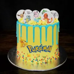 Gotta catch 'em all. This vibrant Pokémon cake is perfect for a kid's birthday party. It features a bright yellow buttercream base, a fun blue drip, and edible prints of favorite characters like Pikachu, Charmander, and Squirtle.