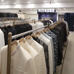 Racks filled with our extensive collection of men's ethnic wear, from classic whites to bold prints and dark hues.