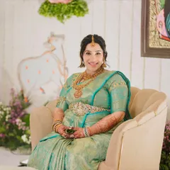 A happy mom-to-be. Her smile says it all. The makeup is designed to be light and comfortable, giving her a natural, radiant glow for her baby shower ceremony.