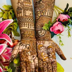 An intricate and personalized Rakhi design. One hand features a brother-sister portrait, while the other is adorned with a majestic peacock, blending personal touches with traditional art.