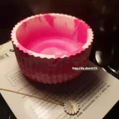 A close-up showing the inside of the pink marbled jar. The smooth, polished interior contrasts beautifully with the textured exterior.