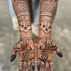 A gorgeous engagement mehendi with the couple's initials 'R' and 'C' hidden in the design. The pattern is a beautiful mix of traditional peacock and geometric elements.