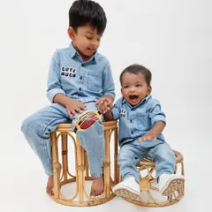 Sibling photos are so special. This shot captures the sweet connection between an older brother and his baby sibling. I use simple props like these rattan stools to add a touch of warmth without distracting from the moment.