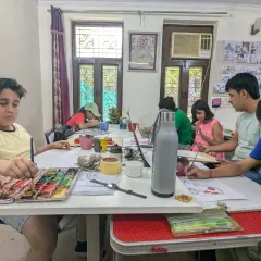 A typical class scene with students deeply engaged in their watercolor paintings. We encourage a focused yet relaxed atmosphere for learning.