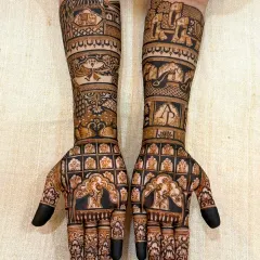 Another beautiful bridal design without human figures. This one features intricate jaali work on the palms, combined with traditional elephant and bird motifs on the forearms, showcasing a different style of non-figurative art.