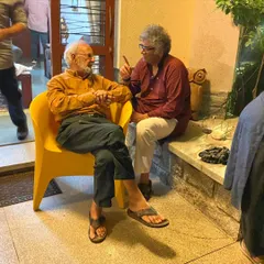 A candid photo from a dinner hosted in honor of the artist Gulammohammed Sheikh. These gatherings bring together artists, curators, and friends to celebrate and connect.