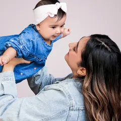The bond between a mother and her child is a story without words. I aim to capture that pure connection in a simple, timeless portrait.