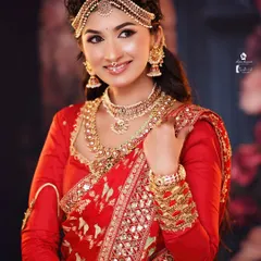 A stunning bridal look created during my pro batch. This showcases advanced techniques in creating a flawless base, intricate eye makeup, and traditional hairstyling.