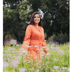 A simple, joyful portrait session in one of Delhi's beautiful gardens. My focus here was on using the natural light and vibrant colors of the flowers to complement her bright personality, creating a relaxed and authentic lifestyle photo.