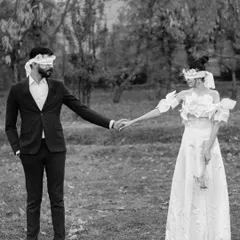 A conceptual pre-wedding photo in Kashmir. Blindfolded, they hold hands, a symbol of their complete trust and the journey they are taking together into the unknown.