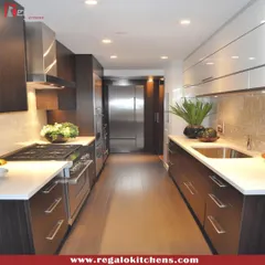 This galley kitchen combines dark wood cabinets with stainless steel appliances for a professional, modern look. The parallel layout is perfect for a streamlined cooking process, with everything you need located within a few steps.