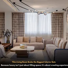 This living room at M3M Gurgaon proves that luxury is about creating experiences. We designed this space with ample seating and a soothing color palette for ultimate comfort.