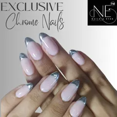 An elegant chrome French manicure. We used a highly reflective silver chrome for the tips on these almond-shaped nails, offering a modern alternative to the classic white.