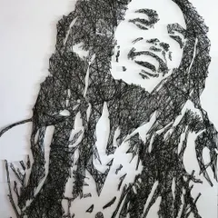 This Bob Marley portrait was created entirely with nails and a single continuous black thread. String art is a meticulous process, but it creates a stunning, graphic effect with amazing depth.