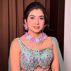 A close-up of Surbhi's Mehendi makeup. The look is bright and fresh, perfect for a daytime event.