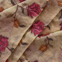 This organza fabric features a bold, artistic rose pattern. The deep magenta and muted gold threads create a vintage-inspired design that would make a stunning custom jacket or a unique saree.