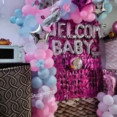 A closer look at the welcome baby home decoration, showing the details of the balloon arrangements and character foils. I ensure the setup is neat and full, providing a great background for your family pictures.