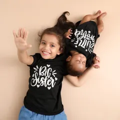 Big sister and little sister! I love this fun pose and their matching shirts. Capturing the bond between siblings is so special. ❤️