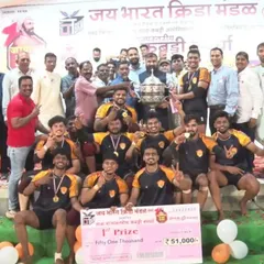 Another angle of our team with the championship trophy, a testament to our collective effort and training.