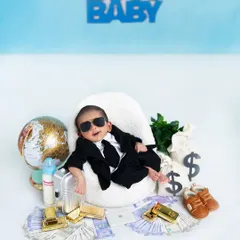 Your little one is ready for business in this 'Boss Baby' setup. I use a variety of props like miniature money, a tiny laptop, and cool sunglasses to create a humorous and memorable scene.