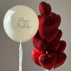 A classic and beautiful combination of red and off white. This bunch features a large personalized "Happy Birthday" balloon paired with a bouquet of red heart shaped foil balloons.