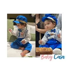 Celebrating a first birthday in style. This little gentleman is wearing our royal blue set with personalized suspenders and a matching cap, looking absolutely charming for his big day.