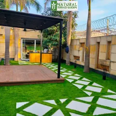 This angle shows the full scope of the Dwarka front yard, with the pergola, bar area, and pathway creating a cohesive and inviting space.