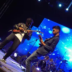 This is what it looks like when raagas meet riffs. My amazing guitarists trading solos during our rock-infused set, bringing a completely different power to traditional Carnatic melodies.