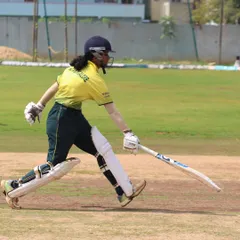 A batter completes a quick single, demonstrating the importance of running between the wickets, a skill we drill constantly.