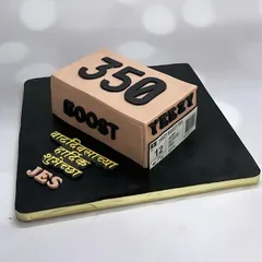 A one-of-a-kind Yeezy shoe box cake for the ultimate shoe enthusiast. The entire box is edible.