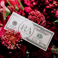 A small detail with a big impact. We created custom dollar bills with the couple's monogram, used for a money shower during a performance.