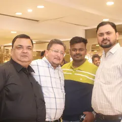 A group of male guests enjoying the event and posing for a photo.