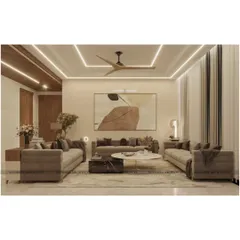 This view highlights the clean lines and modern elegance of the drawing room. The neutral color palette is punctuated by abstract art and layered lighting from the ceiling, creating a calm and sophisticated environment for relaxation and conversation.