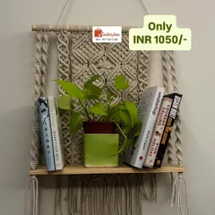 This beautiful and functional wall shelf is perfect for holding your favorite books and a small plant. The intricate macrame backdrop adds a lovely textural element to your wall. And what a deal!